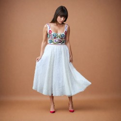 White mi-long sleeveless floral dress with square neckline.