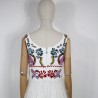 White mi-long sleeveless floral dress with square neckline.