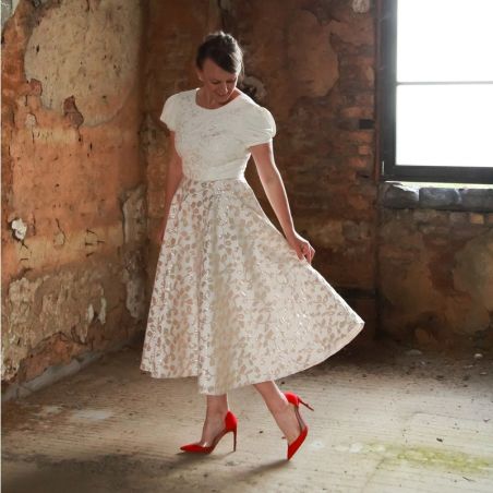 Alternative midi length wedding dress with short sleeves and V at the back