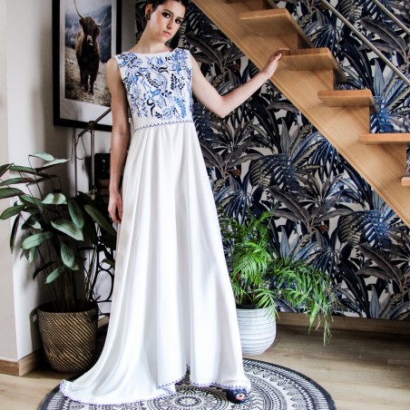 White floor length hand embroidered and sleeveless linen wedding dress.